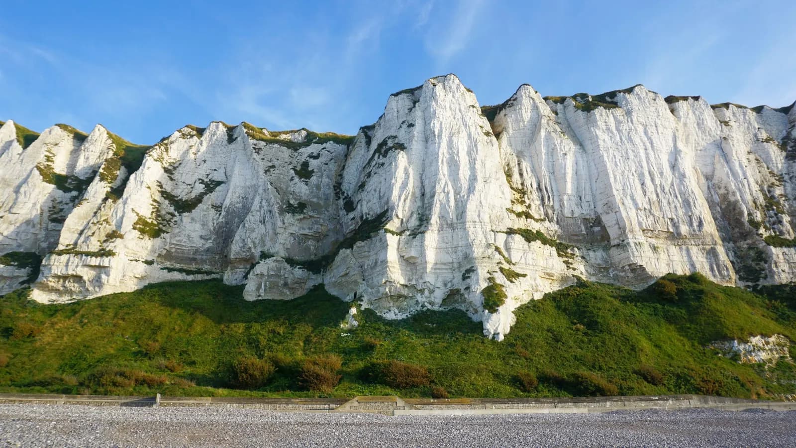 The White Cliffs of Dover on the English coast under a blue sky — representing the border between EU and UK packaging law